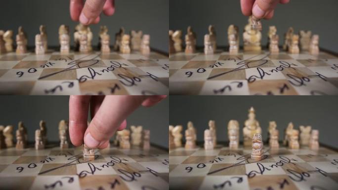 男子移动棋子男性手棋子不寻常的象棋以狮子慢动作的形式关闭