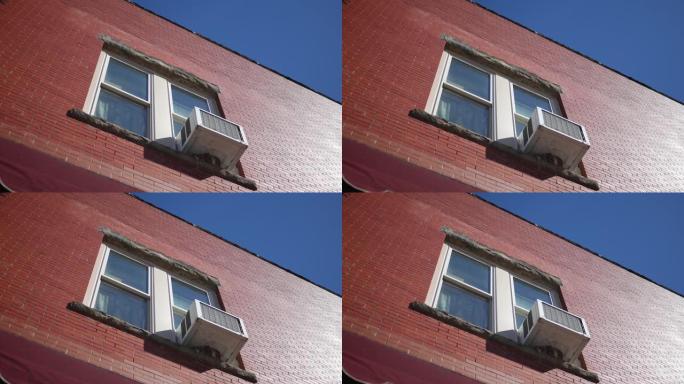建立二楼公寓的镜头，空调单元伸出窗外