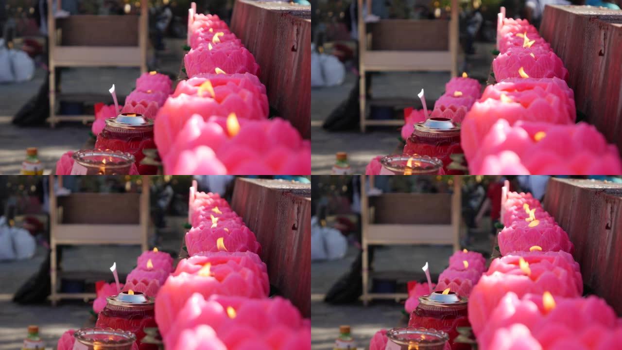 庆祝农历新年期间，道观教堂燃烧的粉红色蜡烛产生的火焰。4k