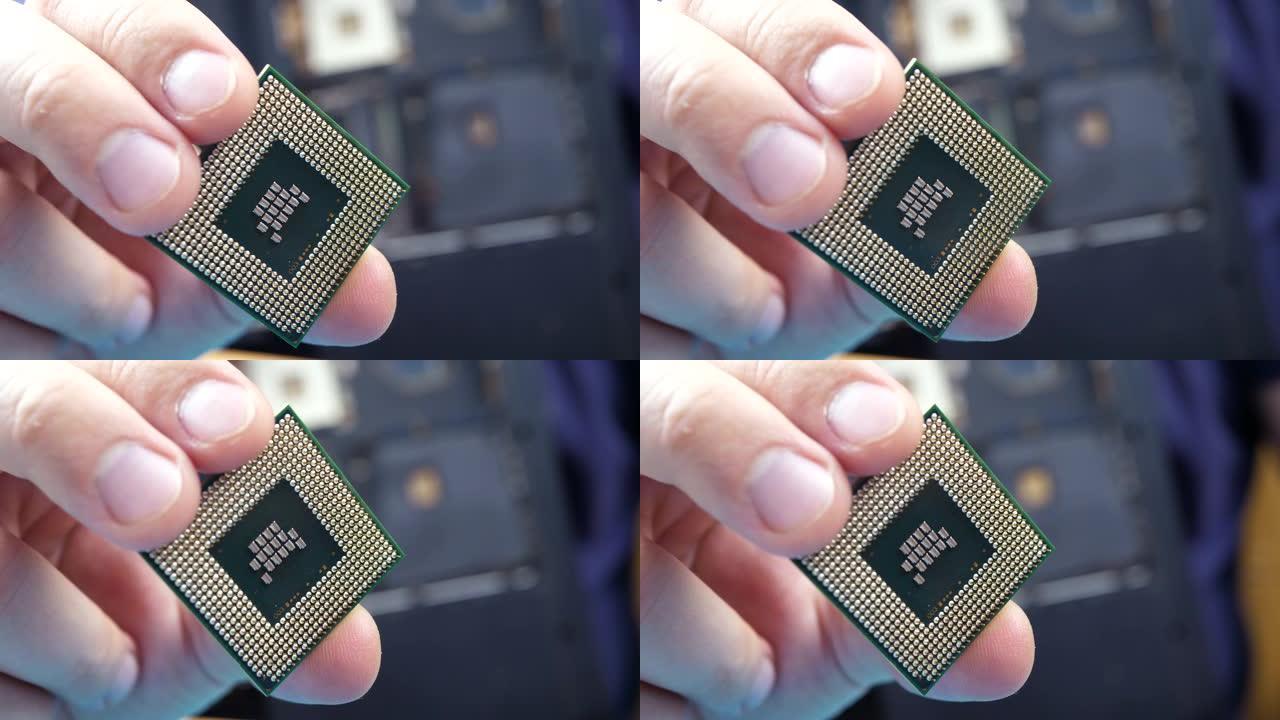 电脑修理工手握电脑CPU处理器
