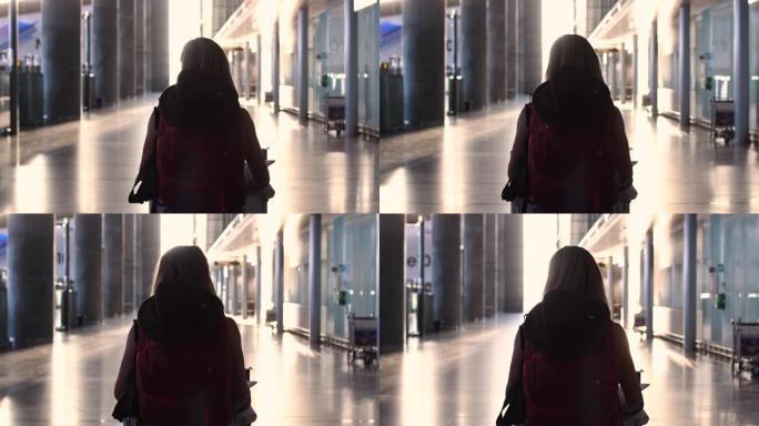 一个女人在机场散步的视频。