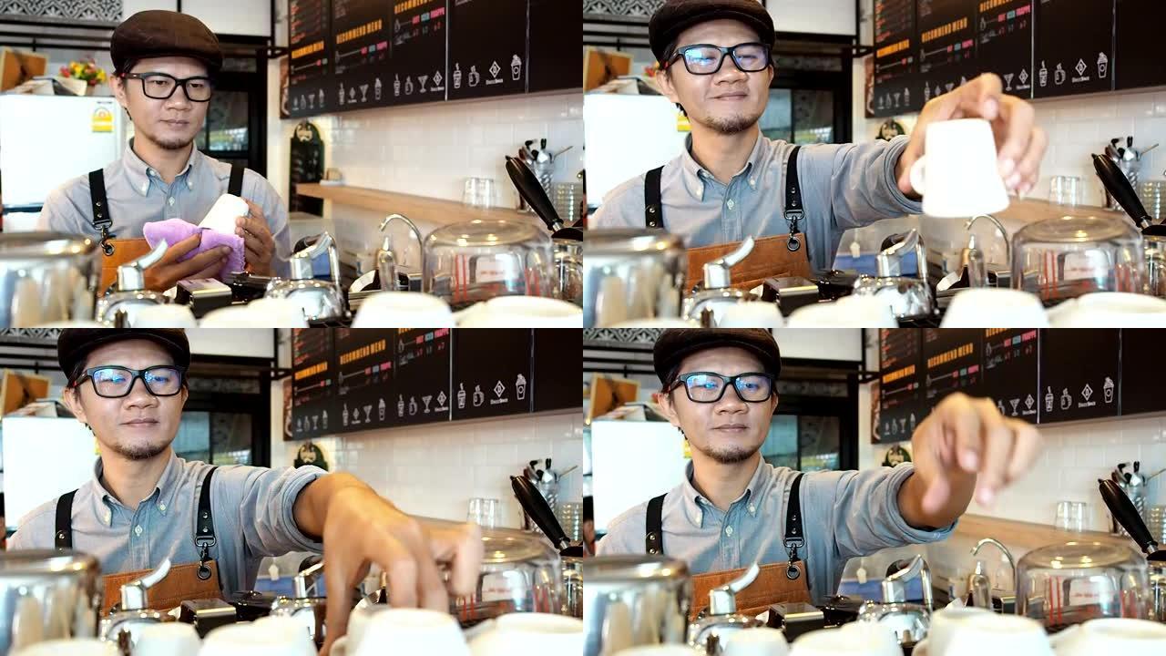 咖啡店企业主擦清洁咖啡杯