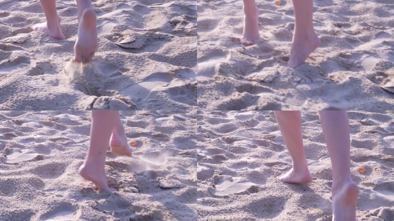 女孩赤脚在沙滩上tip脚走路