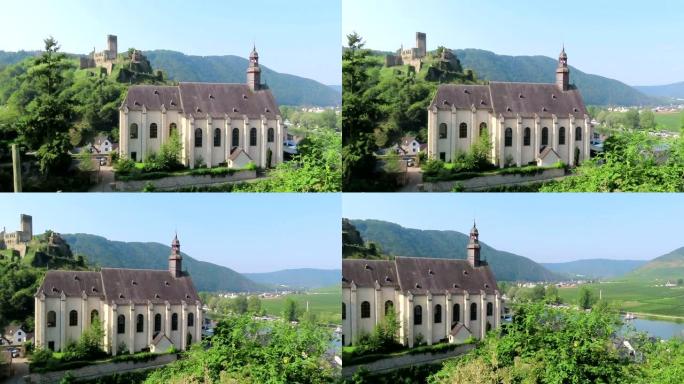 德国摩泽尔河贝尔施泰因的胭脂红教堂。葡萄园景观。