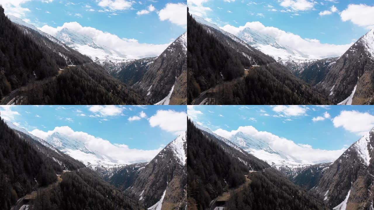 鸟瞰图的雪峰瑞士阿尔卑斯和松树林峡谷。瑞士
