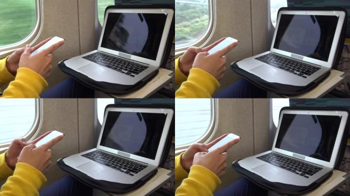 4k女人在火车上使用智能手机和计算机进行短信