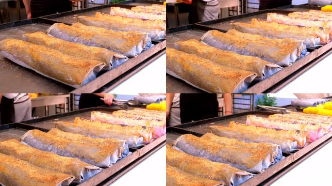 街头美食。煮熟的沙瓦玛躺在街头食品商店的柜台上