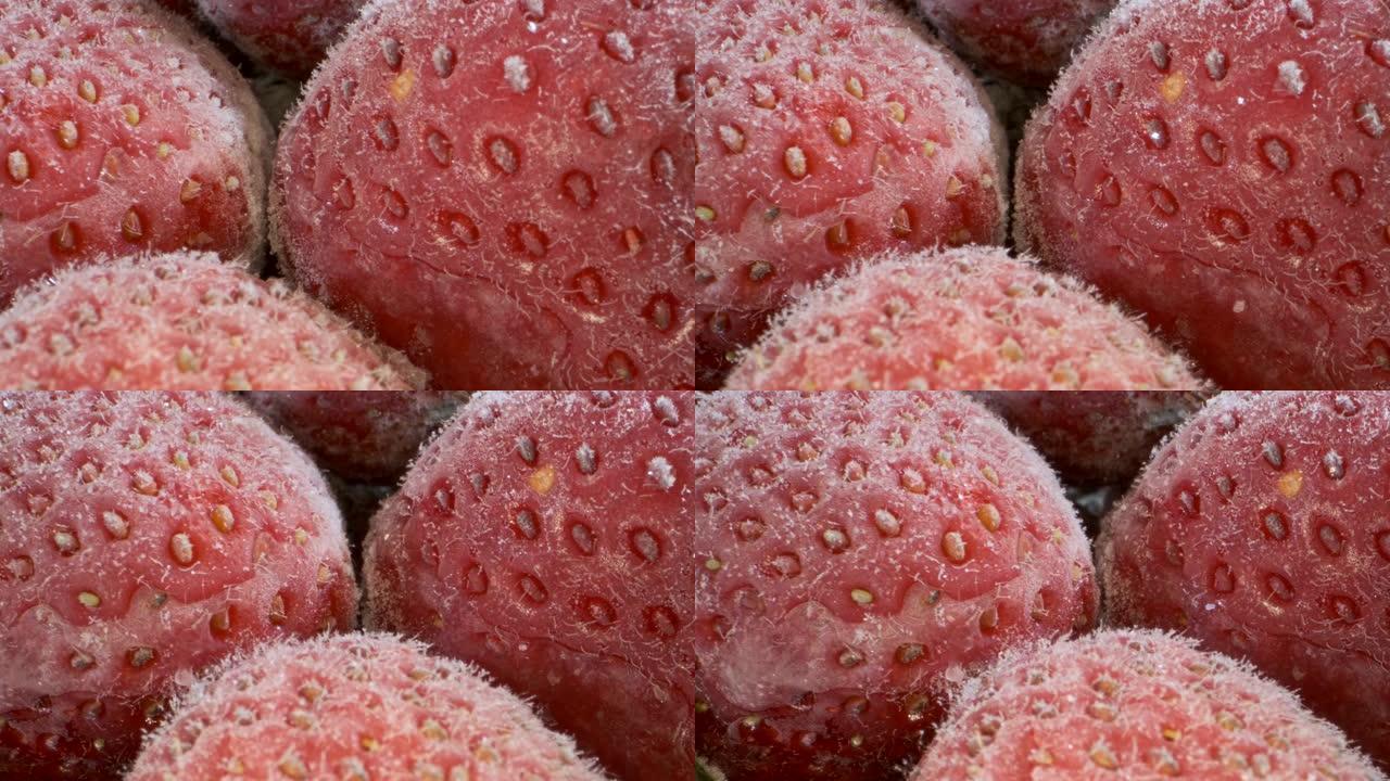 新鲜冷冻草莓的极端特写，旋转360度，特写