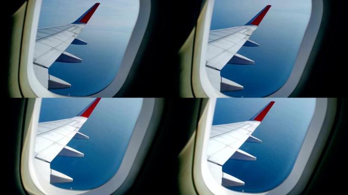 飞机向右转，向上向下。从平面窗口看到机翼和云层。