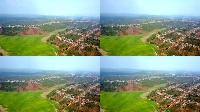 稻田背后的flycam显示了山丘上的村庄
