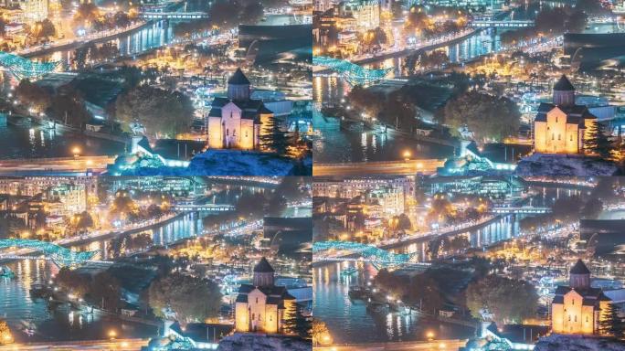 格鲁吉亚第比利斯。著名地标的俯视图-Metekhi教堂，夜间照明中的和平之桥。格鲁吉亚首都天际线城市