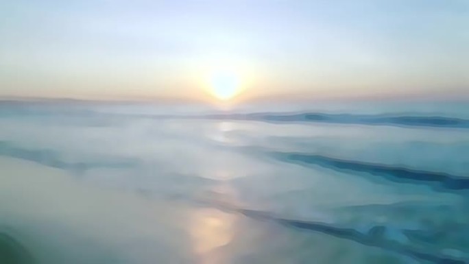 日落和柔软的海洋在沙质的傍晚海滩模糊的背景为视频过渡。天空中的早晨日出和海滩上的海浪，用于撰写视频片
