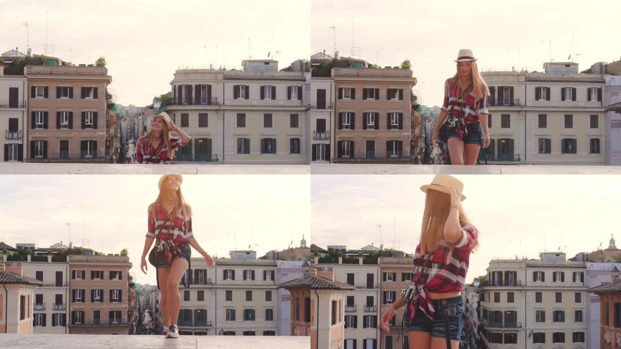 年轻的金发女子带着老式相机在罗马走上西班牙台阶，拍照，意大利。