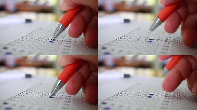 学生在练习中进行手工测试在考场的学校或大学用铅笔填写考试复写纸答题纸，在校园教室记录考试，教育或返校
