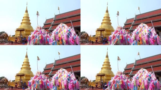 在兰汶的哈利蓬斋Wat para that Hariphunchai的沙堆上装饰着传统的旗帜