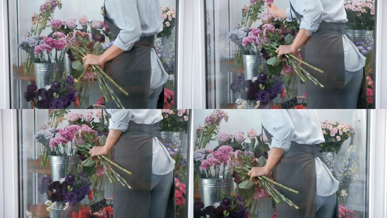 女性花店为花束选择鲜花