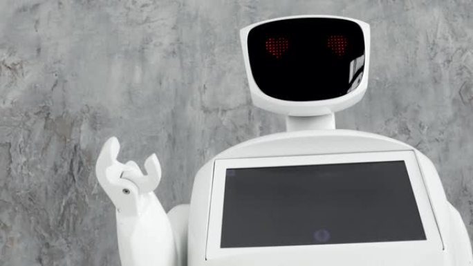 现代机器人技术。机器人看着摄像机看着那个人。机器人表现出情感。举起双手，跳舞或愤慨。或者攻击