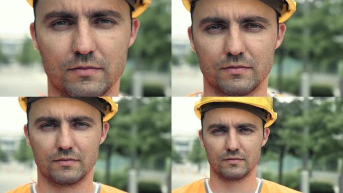 戴着头盔的男性工业工人的肖像看着相机