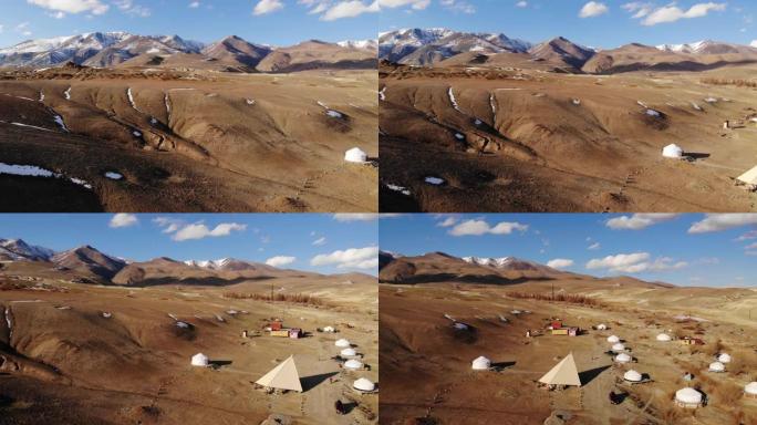 雪山中的蒙古包营地