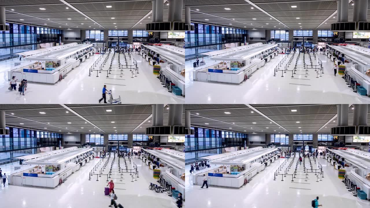 4k延时高角度视角旅客在机场航站楼离境大厅拍摄。旅客在日本东京成田国际机场的机场柜台大厅里带着行李步
