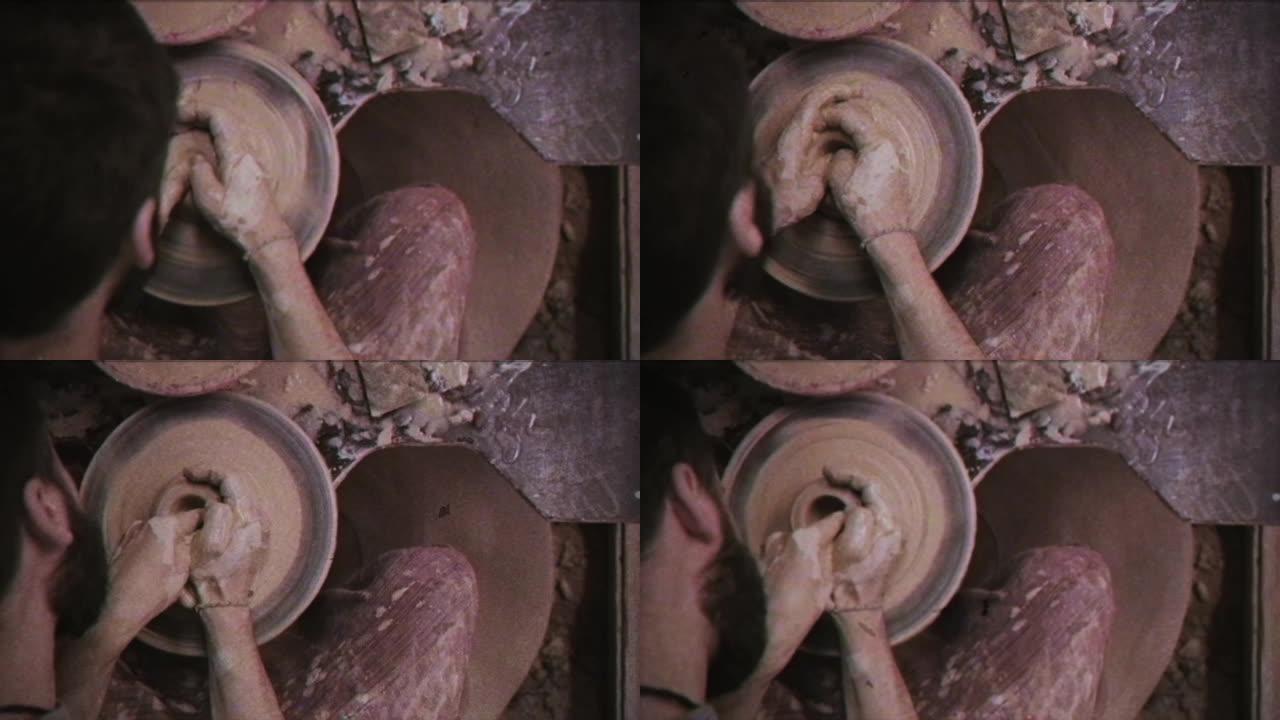 陶工用一壶粘土制成。复古效果。一个人在陶工的轮子上做花瓶