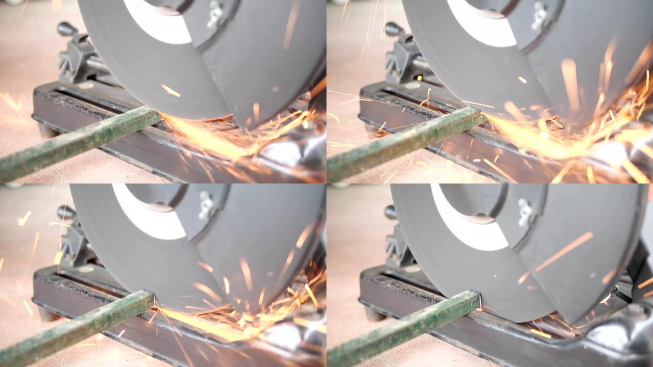 机械工程师用电动圆锯切割钢结构，4k慢动作镜头。