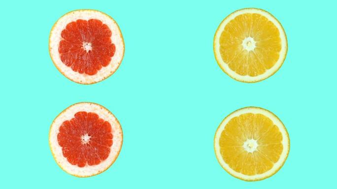 葡萄柚和橙色的两半在氰化物颜色的背景下沿不同方向旋转。孤立。