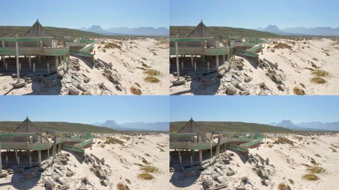 平移镜头显示Macassar Pavilion废墟，卢布掉在沙子中