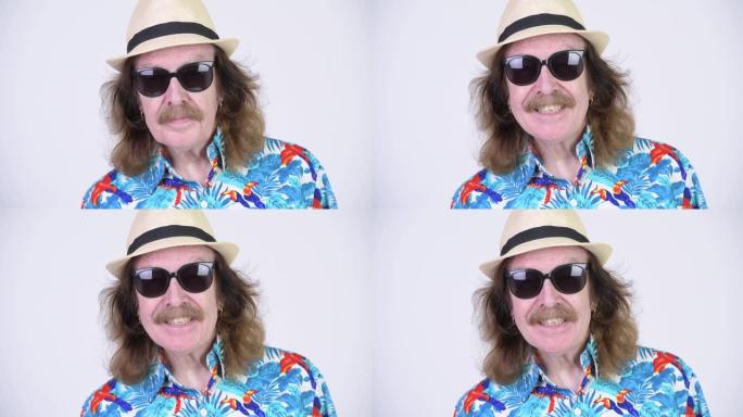 戴着墨镜的胡须准备度假的高级游客的脸