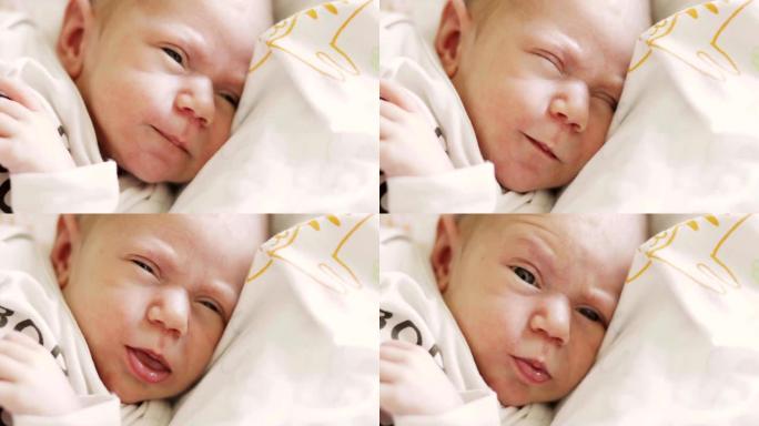 新生儿睡午觉睁开眼睛后打哈欠的肖像