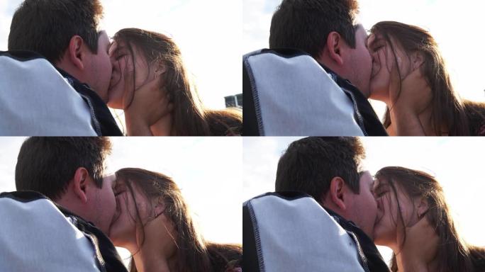 一对恋人浪漫而热情的亲吻在阳光明媚的4K。