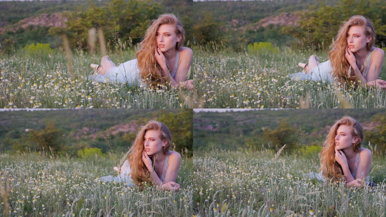 美丽的女孩躺在春天的草地上，种着野花。享受大自然。户外美丽的年轻女子。