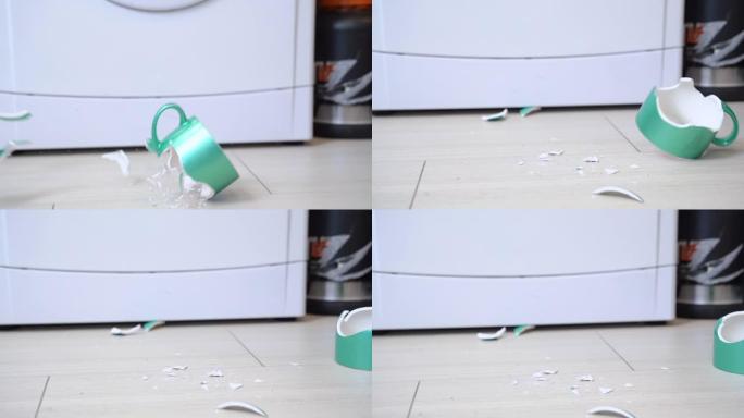 一个空杯子掉到地板上摔碎了。