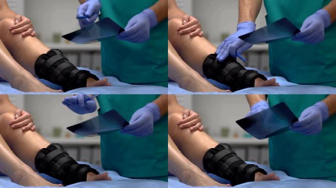 创伤专家向脚踝包裹，医疗保健患者解释x射线结果