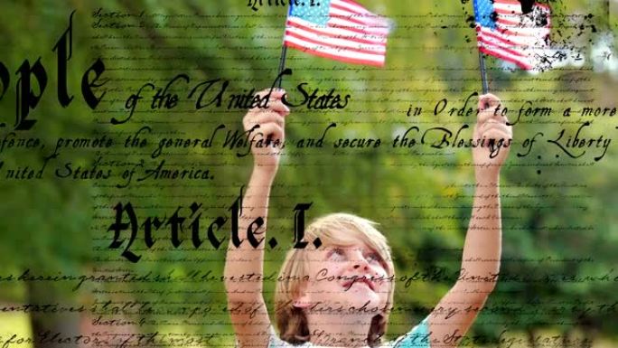 孩子拿着美国国旗和美国成文宪法