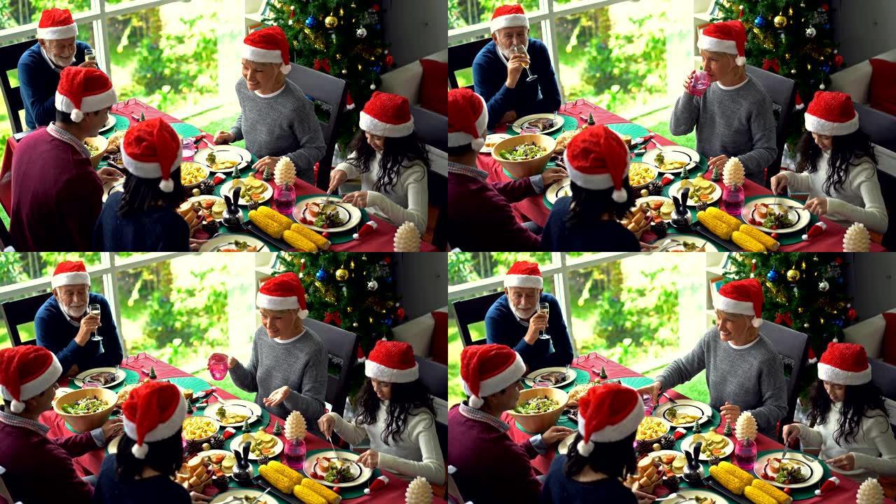 4K圣诞家庭在圣诞节时在餐桌上分享食物