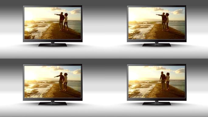 平板电视，屏幕上有一对夫妇在海滩上
