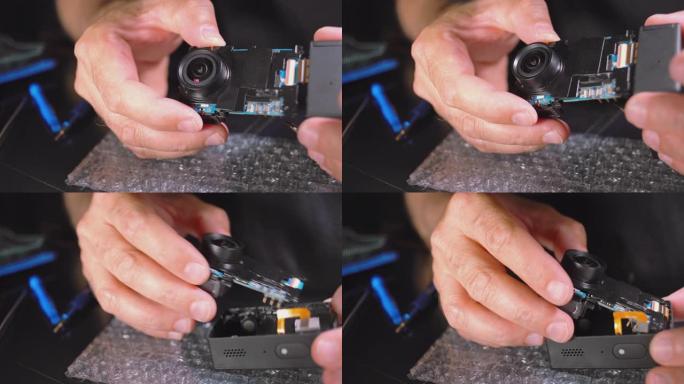 小型电子维修。为运动摄像机服务的人的手的特写视频。