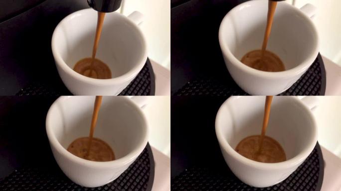 咖啡掉进白色陶瓷杯。慢动作和近距离观察。全高清剪辑