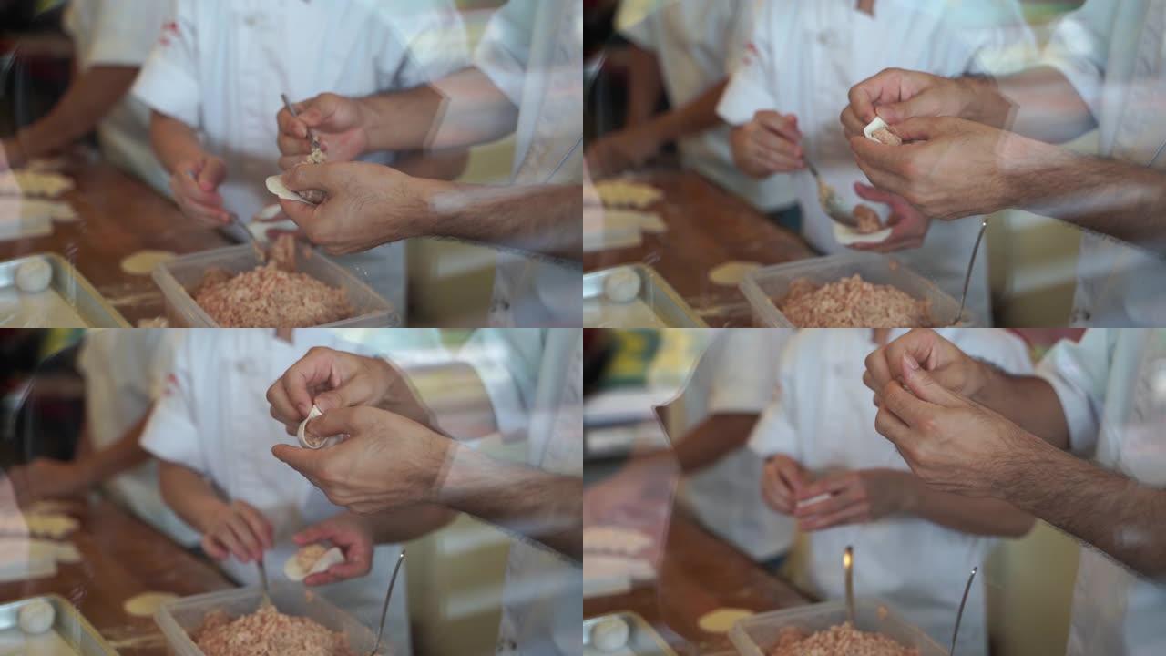 烹饪视频慢动作步骤制作小龙宝这是中国点心菜肴。小龙宝是由面包粉与小麦粉混合制成的，猪肉末在水中装满肉
