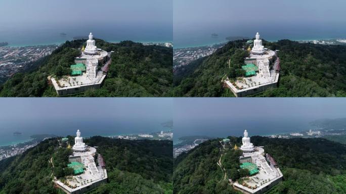 鸟瞰图无人机在泰国普吉岛高山上拍摄大佛像