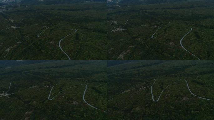雨天M字母形状的山路无人机视频