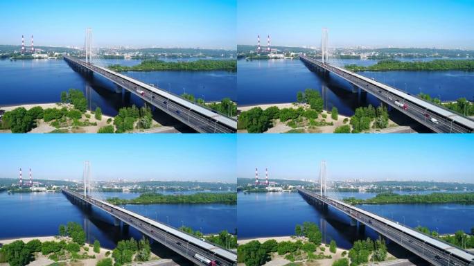 基辅市南桥的空中无人机。乌克兰。第聂伯河，桥过河。河上的城市景观鸟瞰桥两个人爬到桥顶