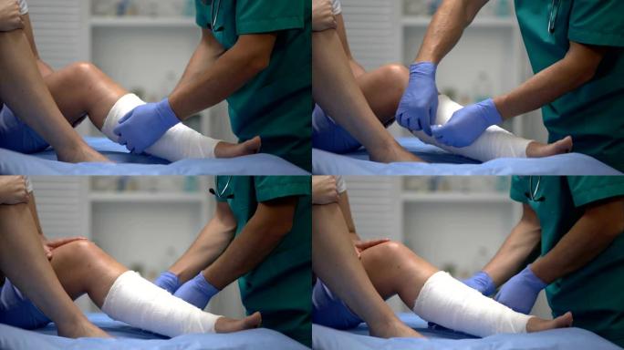 专业外科医生在女性患者腿部、创伤、医疗保健上应用石膏