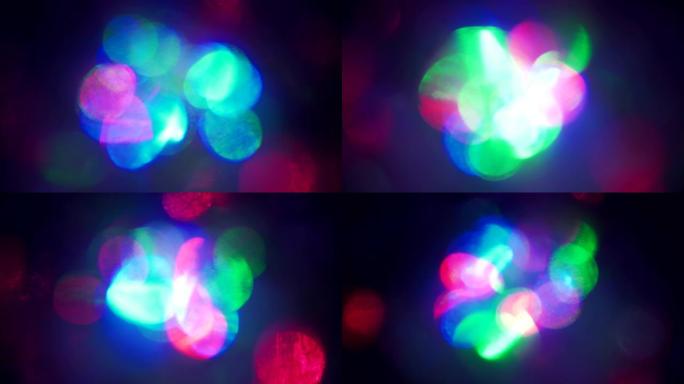 色彩缤纷的圣诞波景，闪烁五彩霓虹灯。抽象模糊的背景，平滑而急剧闪烁的新年粉色蓝色和绿色红色灯光。闪烁