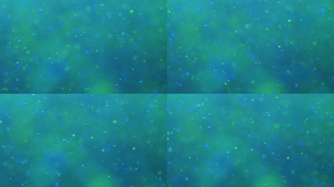 彩色气泡油美丽的油漆蓝色宇宙移动。太空星系行星。星云太空恒星行星。银河系。绿松石表面宇宙在移动。蓝色