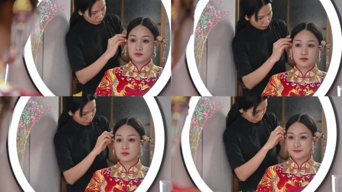 穿着传统婚纱的中国新娘做头发