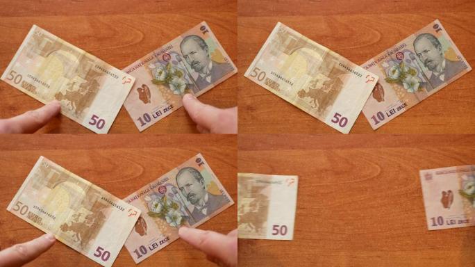 欧元钞票在桌子上与罗马尼亚列伊见面