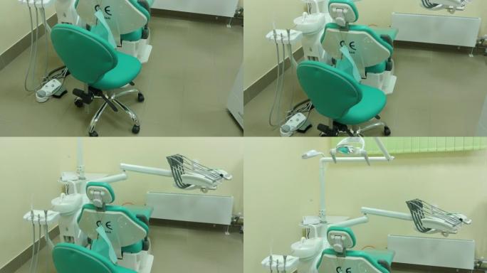 牙医办公室内部的垂直全景与椅子座椅和其他牙科设备，工具。4k视频片段
