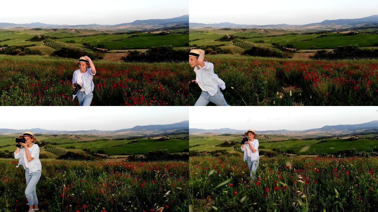 快乐的高加索女性游客，手里拿着相机在乡村风景的暑假里穿过花草草地